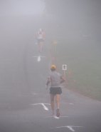 Jamie Boese of Aurora, Colorado heads up the Kerfoot Avenue hill midway through the race, with Thomas Madden and Brad Hinton barely visible