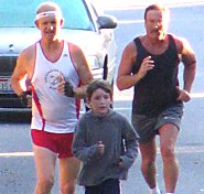 Four-time Festival of Leaves 5K finisher Glenn Luttrell, 10-year-old Paul Griffin, and Larry Gascoigne of Linden